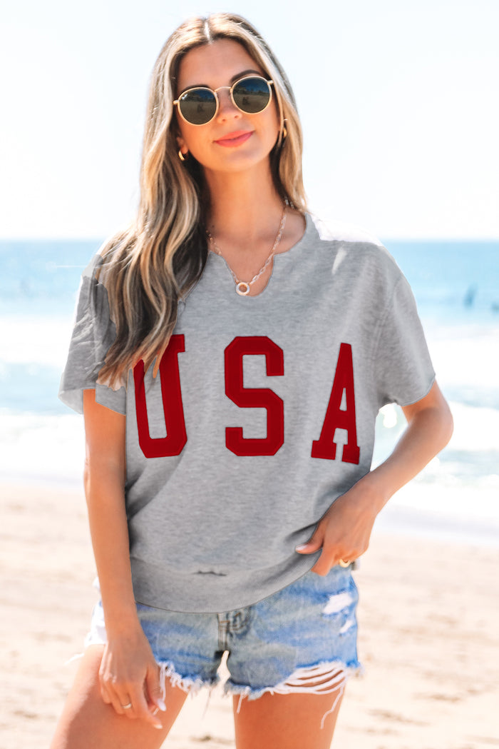 T-shirt ample gris clair avec lettrage USA et col cranté