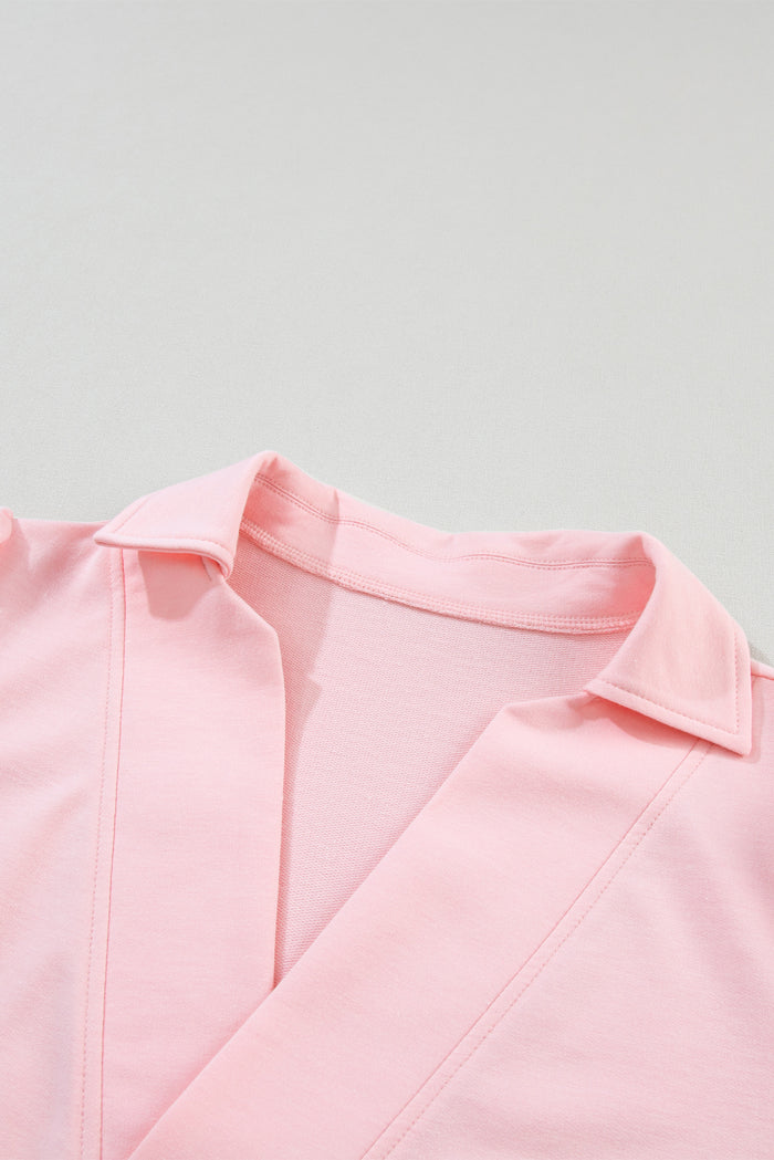 T-shirt rose à col en V et manches bouffantes