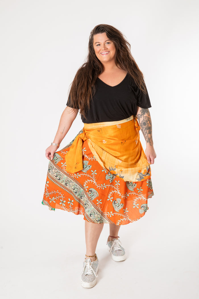 Desiree is wearing a silk wrap skirt in fire on the mountain