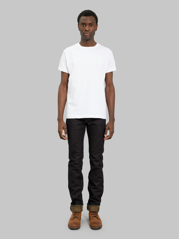 The Strike Gold Brown Weft Slim Jeans model front fit