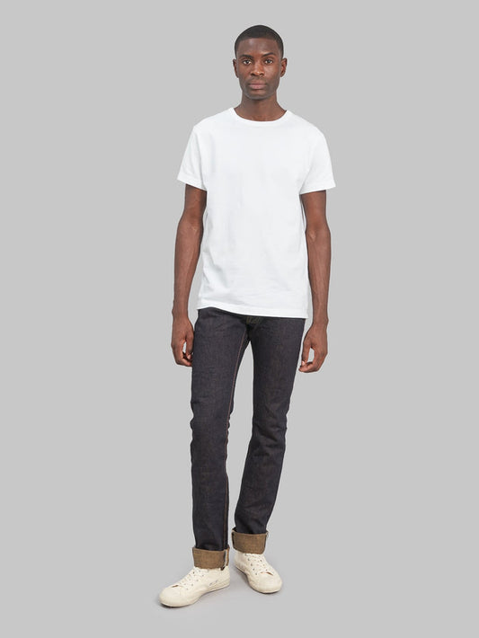 The Strike Gold Brown Weft Slim Tapered Jeans model fit