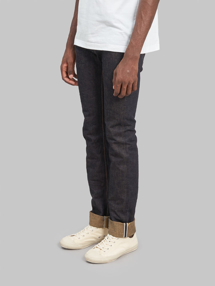 The Strike Gold Brown Weft Slim Tapered Jeans side fit