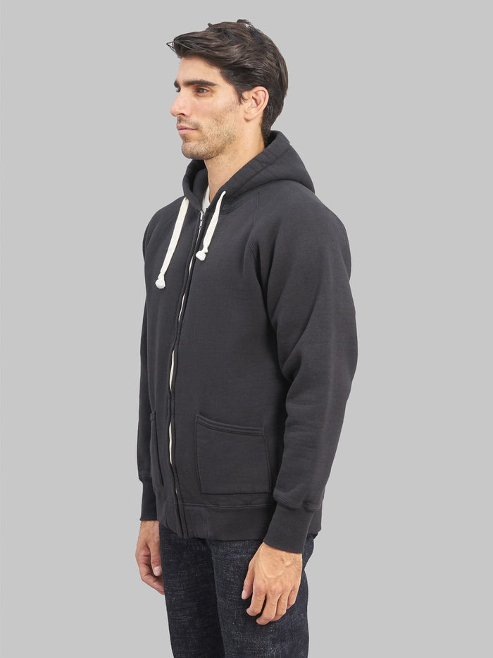the strike gold zip hoodie black model side fit