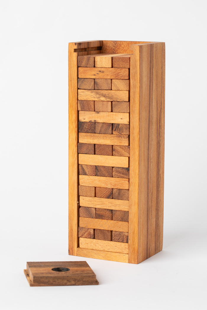 Wooden Timber Tumble stacking game with open case and individual wooden pieces displayed — handmade artisan game.