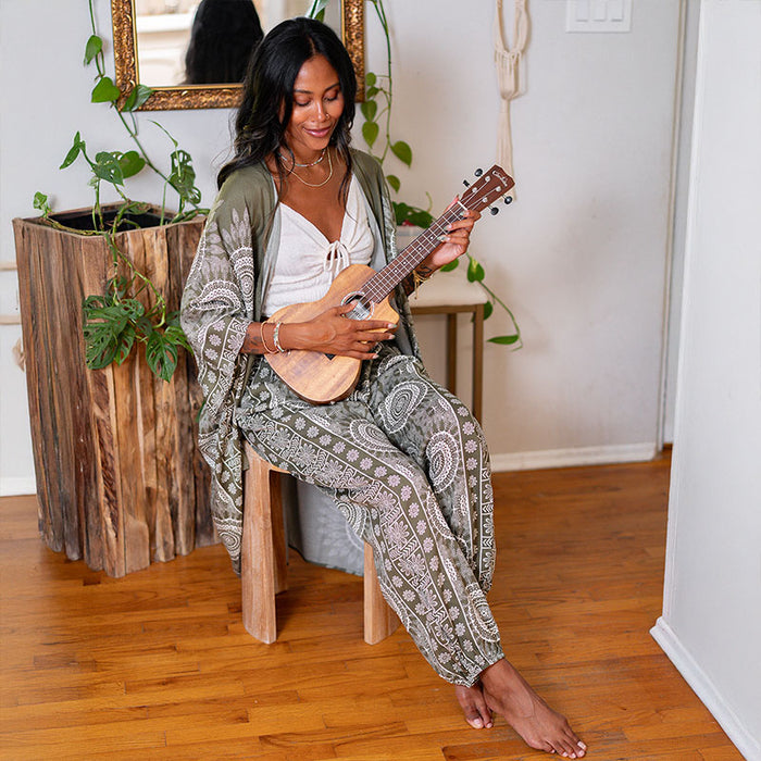 Tuscany Lounge Set, seated with a ukulele