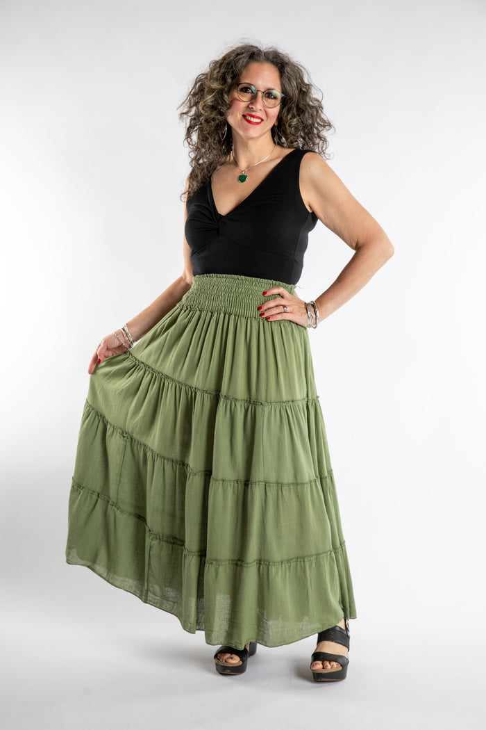 Susan is wearing the Saramati Prairie Skirt in one size in Green