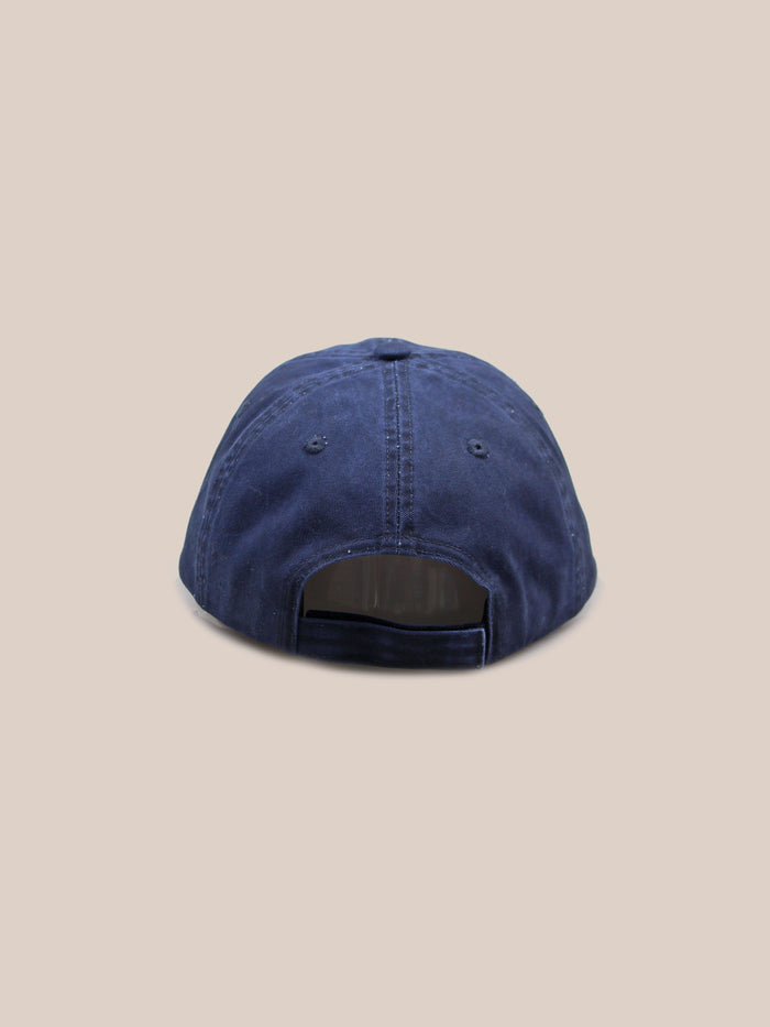 A Two-Tone Logo Cap in blue, offered by the brand FOUND, features a 6-panel design visible from the back, includes an adjustable strap, and has stitched eyelets.