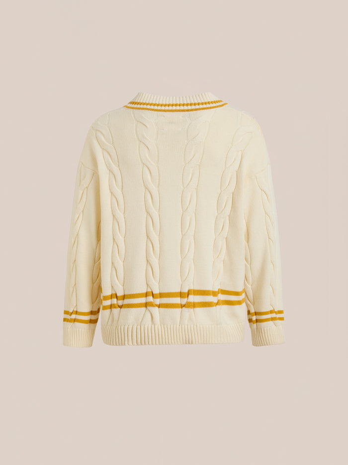 FOUND V-Neck Cricket Sweater in beige, featuring yellow and brown stripes on cuffs, hem, and collar. Shown from the back against a plain background, this unisex sweater offers a classic look with a sporty twist.