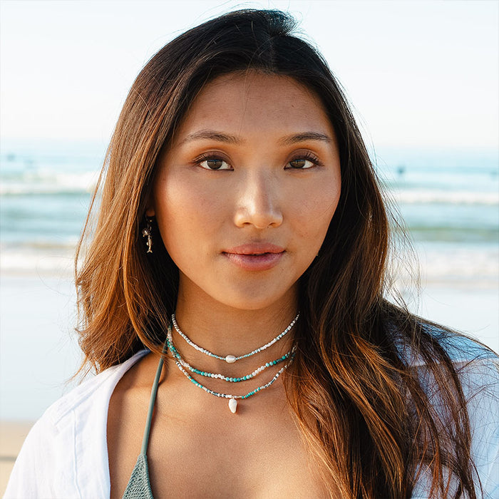 Wavebreak Seed Bead Necklace, worn on the beach
