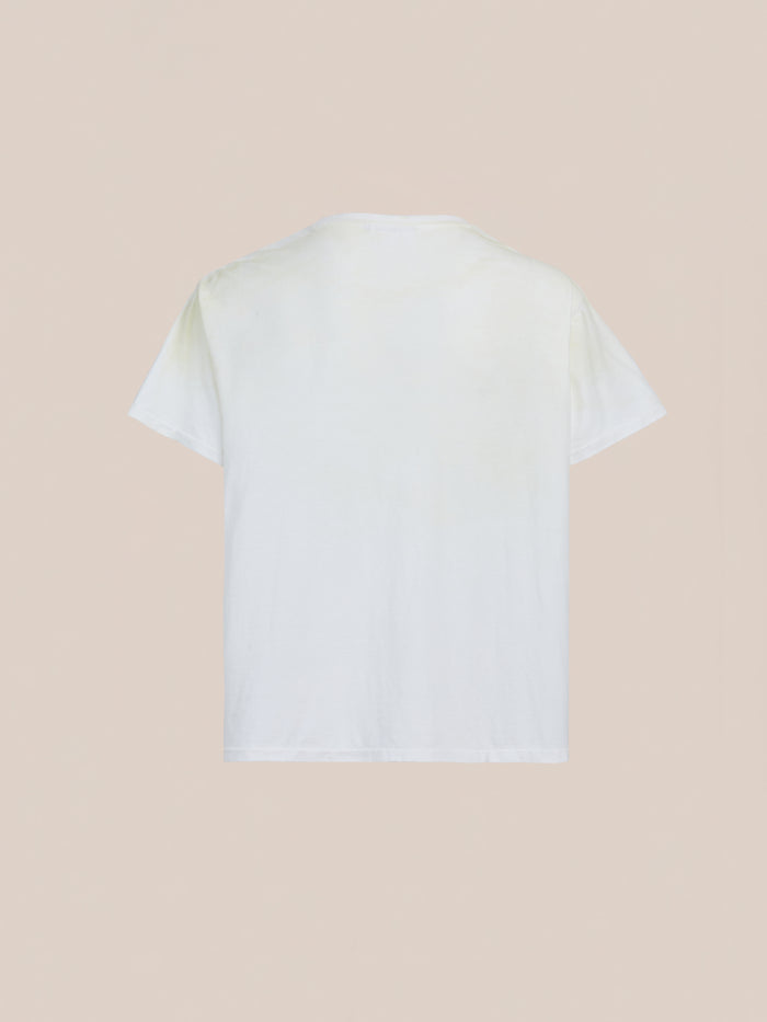 The FOUND Weathered Pocket Tee, a relaxed-fit vintage white shirt, is displayed from the back against a neutral beige background.