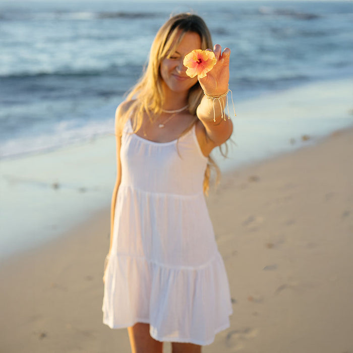White Bahama Sun Dress, on the beach with flower