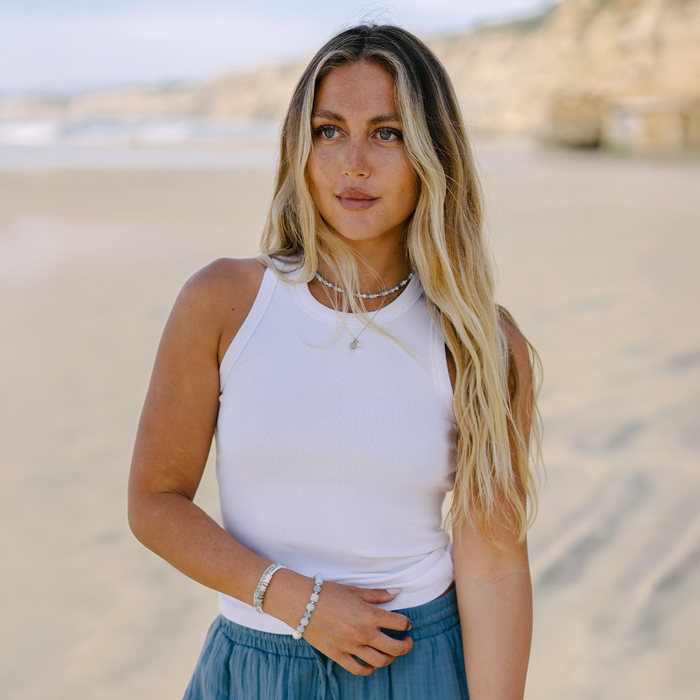 White Full Length Rio Racerback Ribbed Tank, worn on the beach