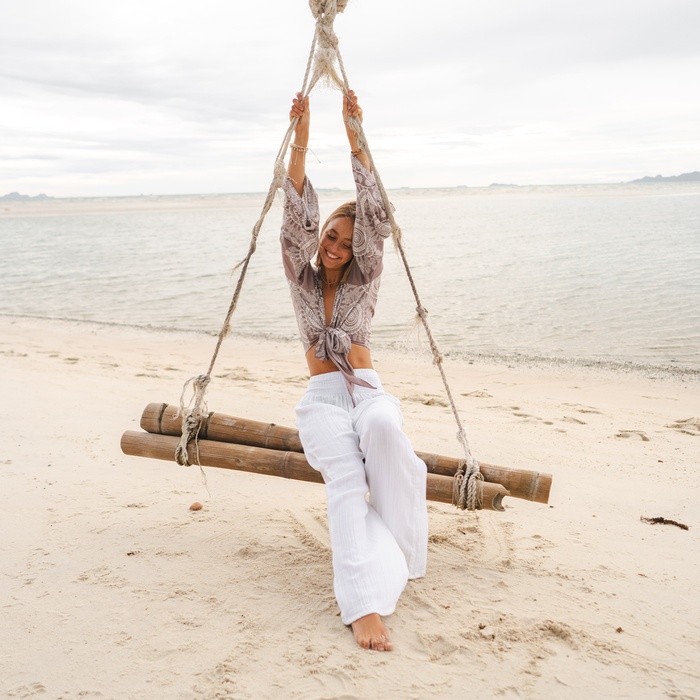 White Wide Leg Beach Cotton Pants, worn on a beach swing