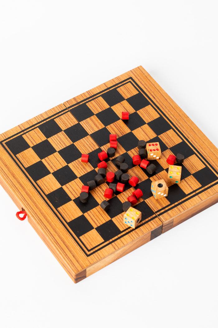 Handmade wooden checkers and backgammon board with red and black playing pieces — artisan wooden game handmade in Thailand.
