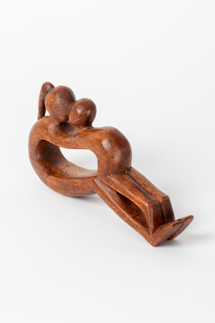 Wooden yoga sculpture in mother and child