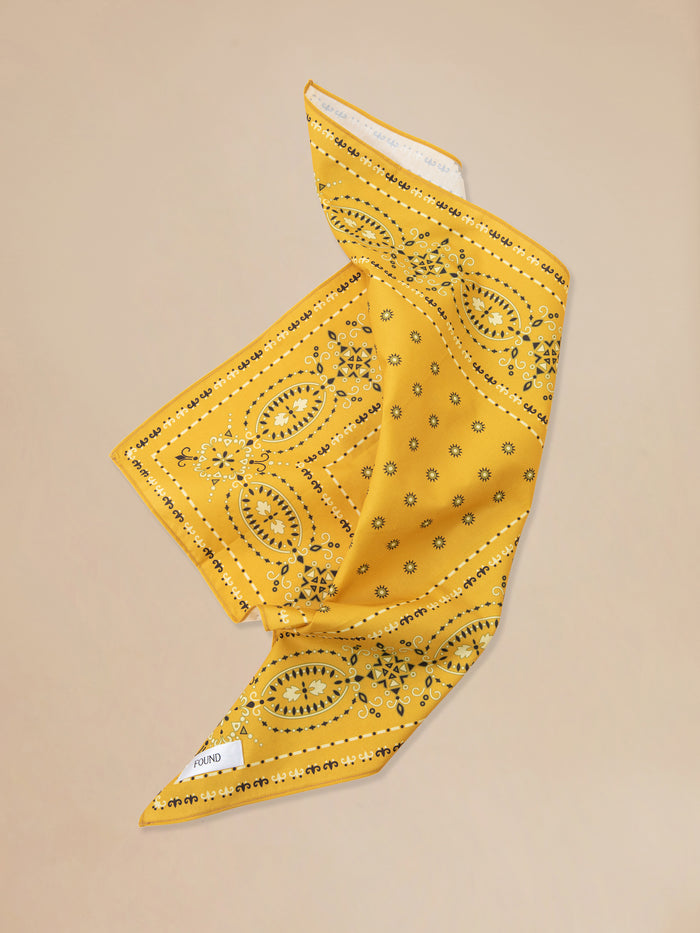A Yellow Western bandana from Found on a beige background.